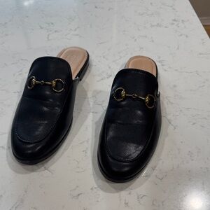 Gucci Black Leather Mules with Gold Accents
